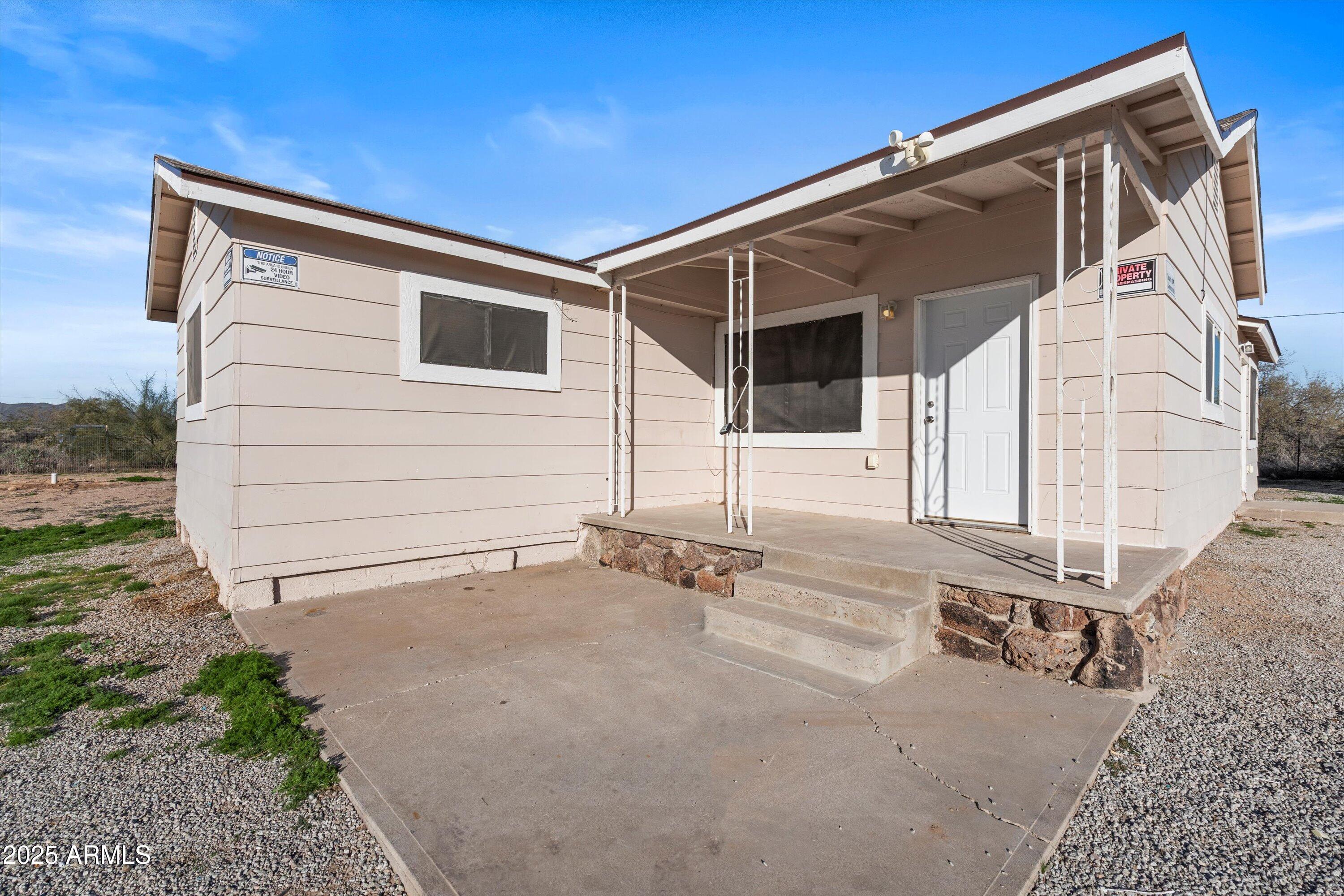 37701 West Buckeye Road Tonopah, AZ 85354 - Photo 11 of 35 a backyard of a house with seating space
