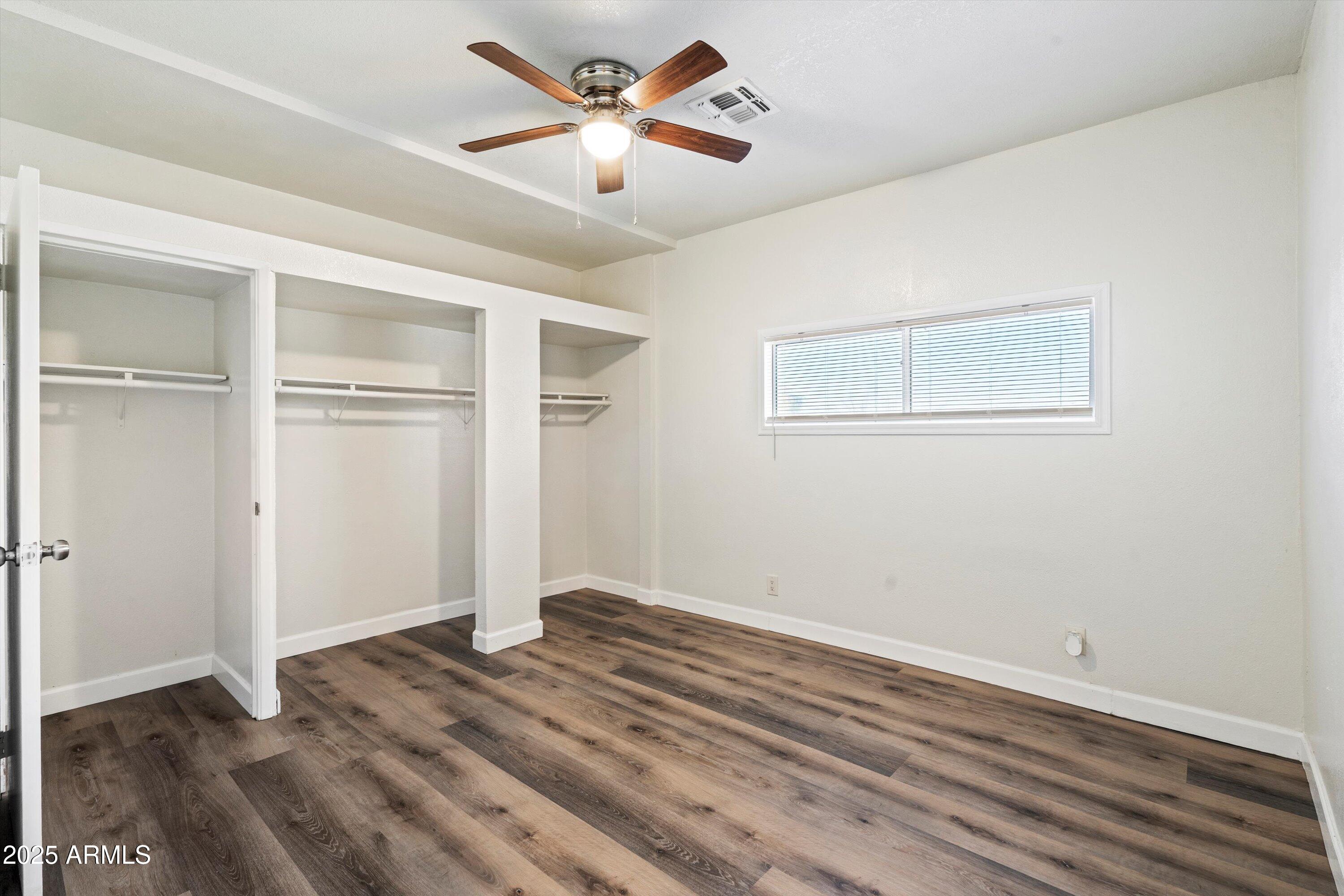 37701 West Buckeye Road Tonopah, AZ 85354 - Photo 22 of 35 a view of empty room with wooden floor