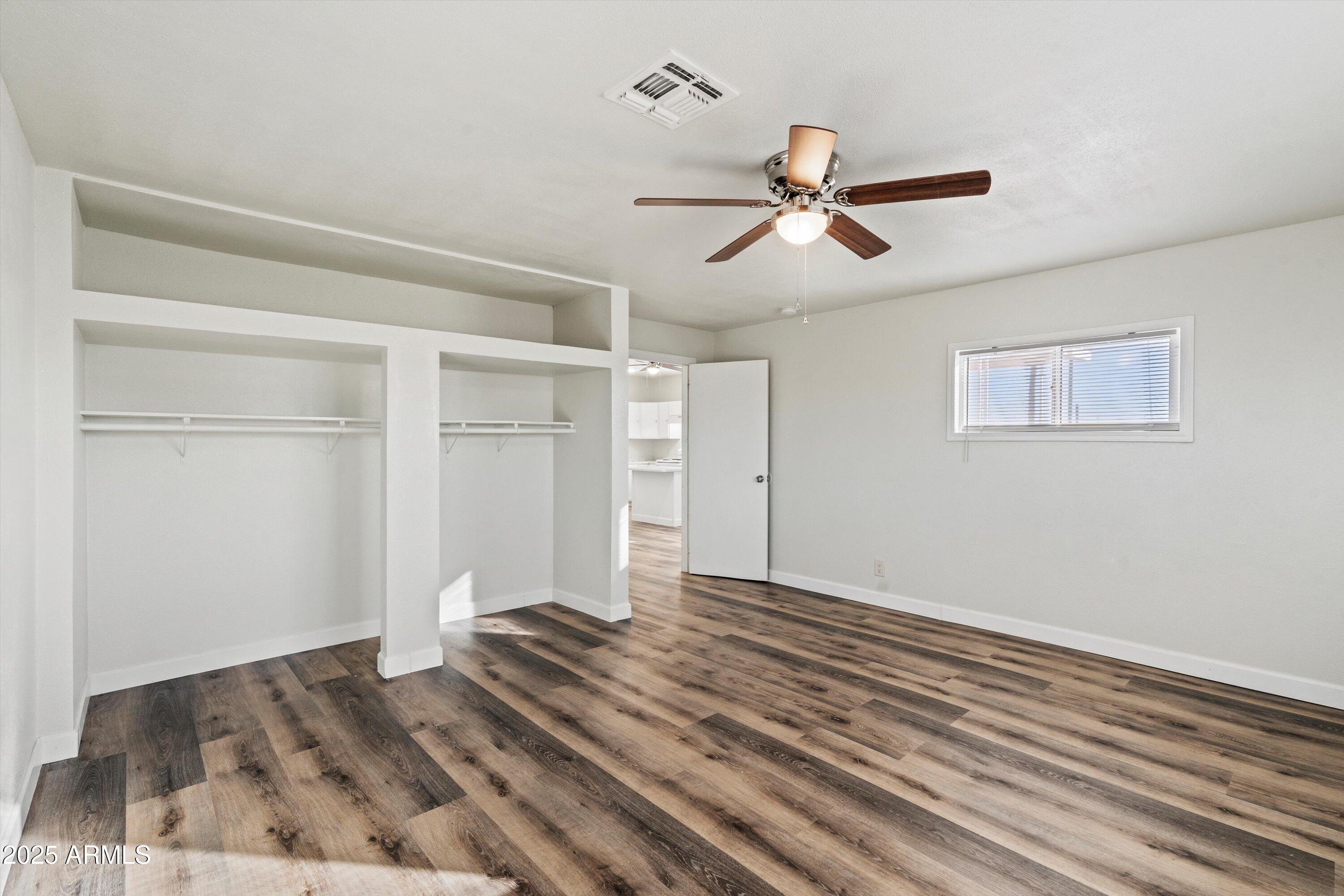 37701 West Buckeye Road Tonopah, AZ 85354 - Photo 26 of 35 a view of empty room with wooden floor