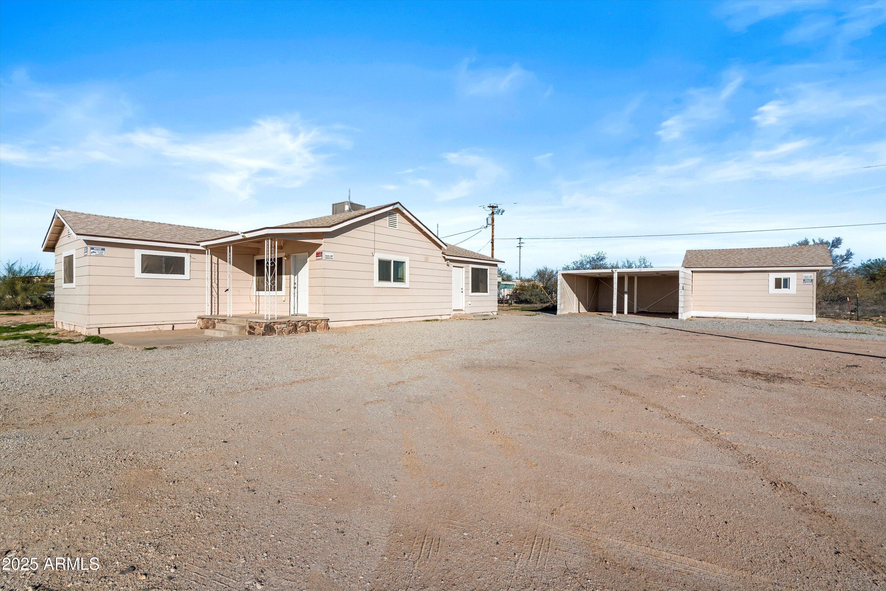 37701 West Buckeye Road Tonopah, AZ 85354 - Photo 8 of 35 a view of a house with a patio