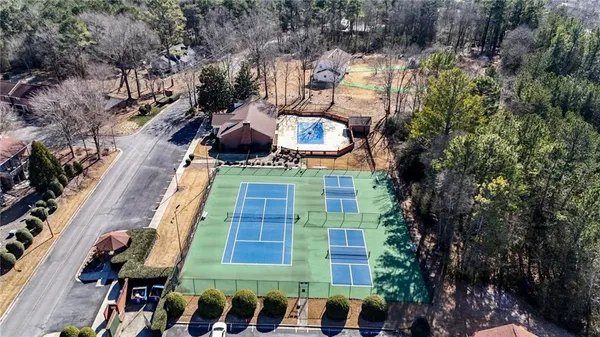 a view of a roof deck with chair and wooden floor