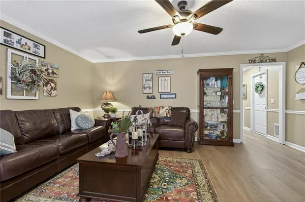 a kitchen with stainless steel appliances granite countertop a refrigerator sink stove and microwave