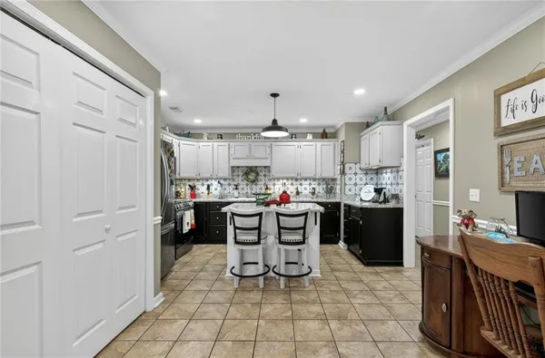 a bedroom with a bed and ceiling fan