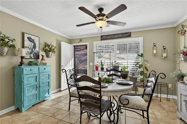 a view of walk in closet with clothes