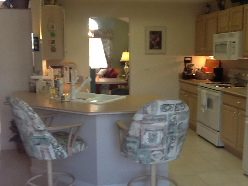 2750 Pointe Circle Greenacres, FL 33413 - Photo 3 of 14 Open Kitchen