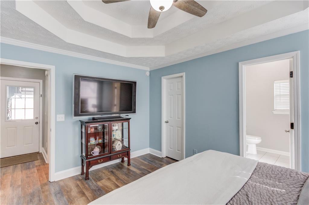 504 Oxford Ridge Winder, GA 30680 - Photo 15 of 30 a bedroom with furniture and a flat screen tv
