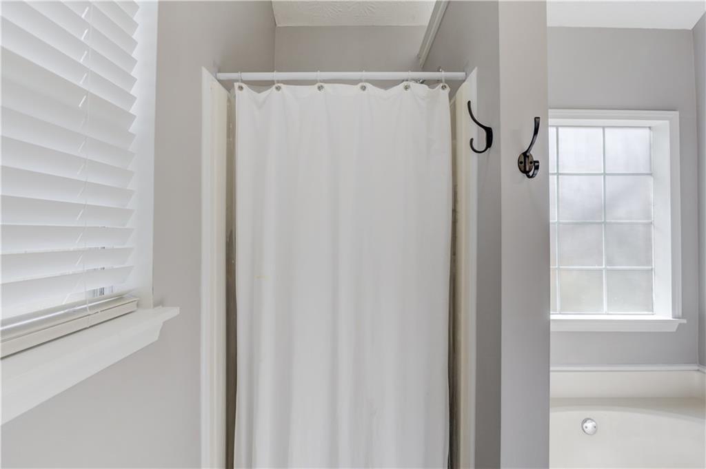 504 Oxford Ridge Winder, GA 30680 - Photo 18 of 30 a bathroom with a glass shower door