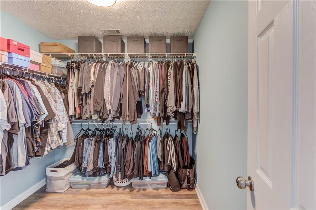 504 Oxford Ridge Winder, GA 30680 - Photo 19 of 30 a view of walk in closet with clothes