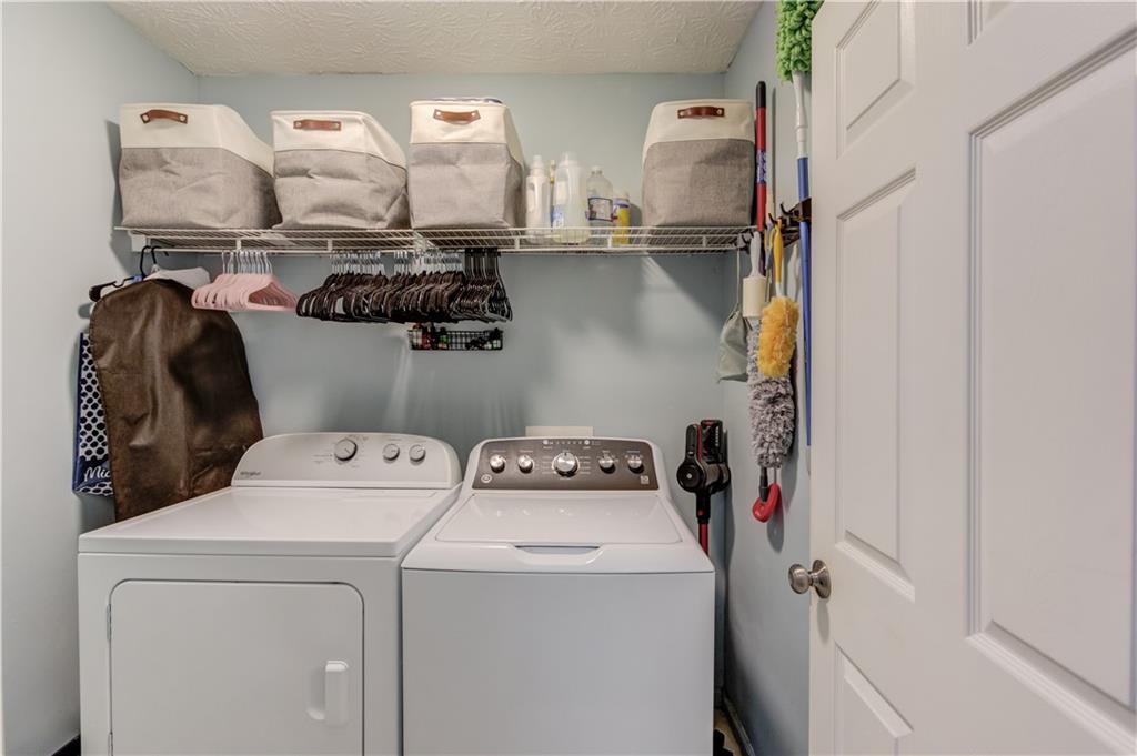 504 Oxford Ridge Winder, GA 30680 - Photo 25 of 30 a view of storage and utility room with washer and dryer