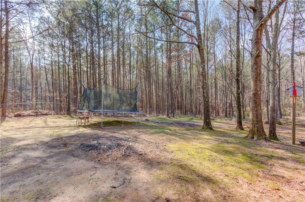 504 Oxford Ridge Winder, GA 30680 - Photo 28 of 30 a view of a backyard with large trees