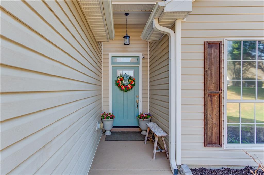 504 Oxford Ridge Winder, GA 30680 - Photo 4 of 30 a view of a house with a potted plant and a window