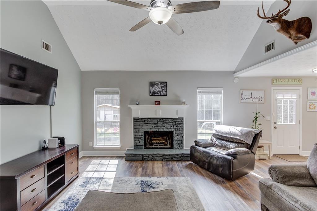 504 Oxford Ridge Winder, GA 30680 - Photo 6 of 30 a living room with furniture and a fireplace