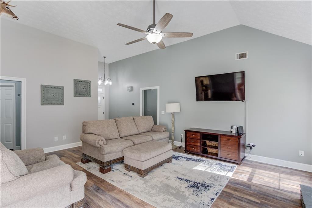 504 Oxford Ridge Winder, GA 30680 - Photo 7 of 30 a living room with furniture a flat screen tv and a fireplace