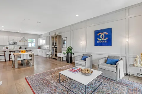 a living room with furniture and a table
