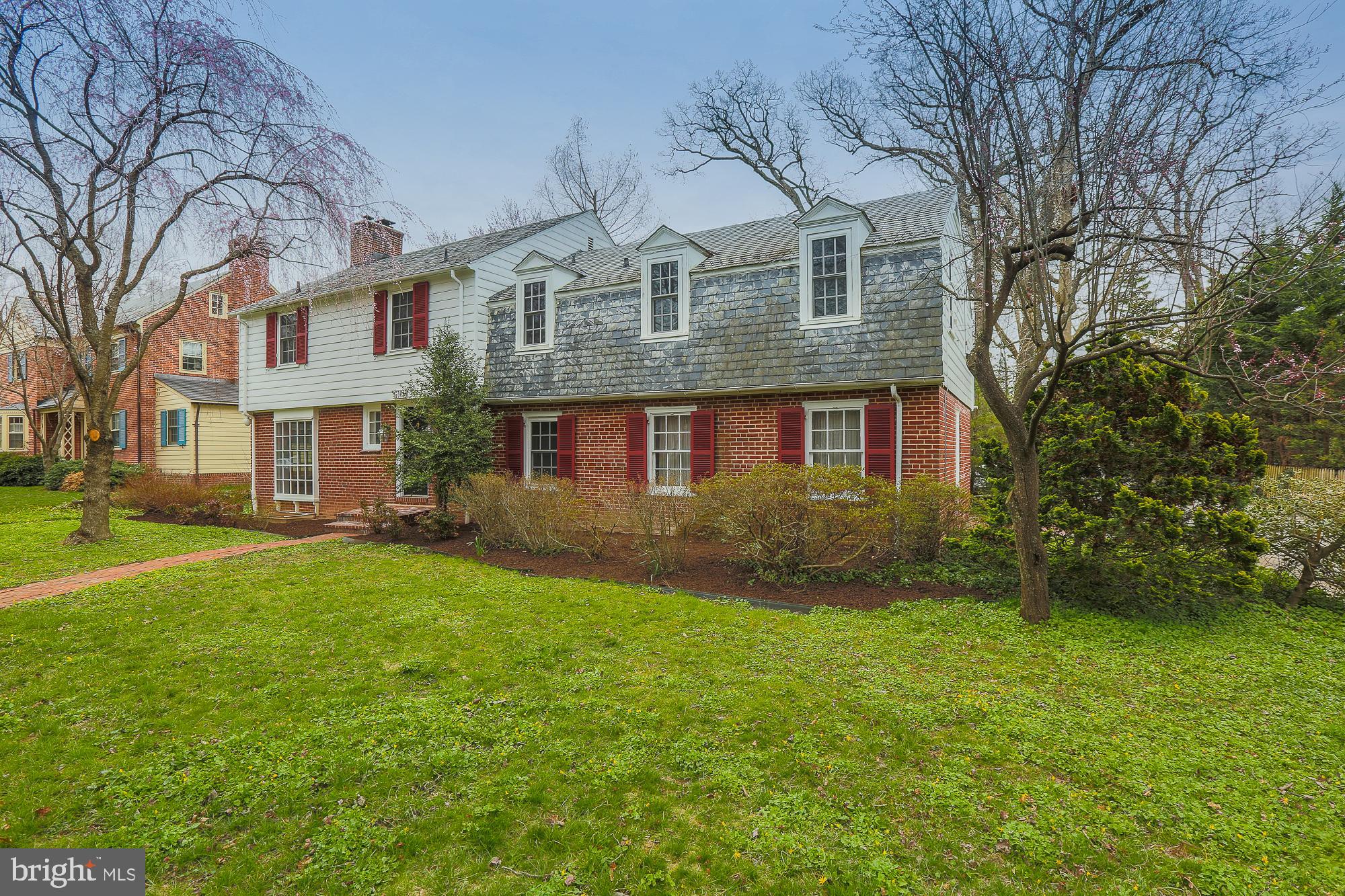 5409 Springlake Way Baltimore, MD 21212 - Photo 3 of 41 a front view of a house with a yard