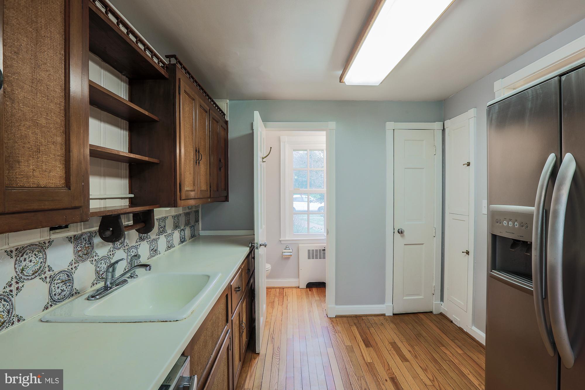 5409 Springlake Way Baltimore, MD 21212 - Photo 22 of 41 a kitchen with a refrigerator and a sink