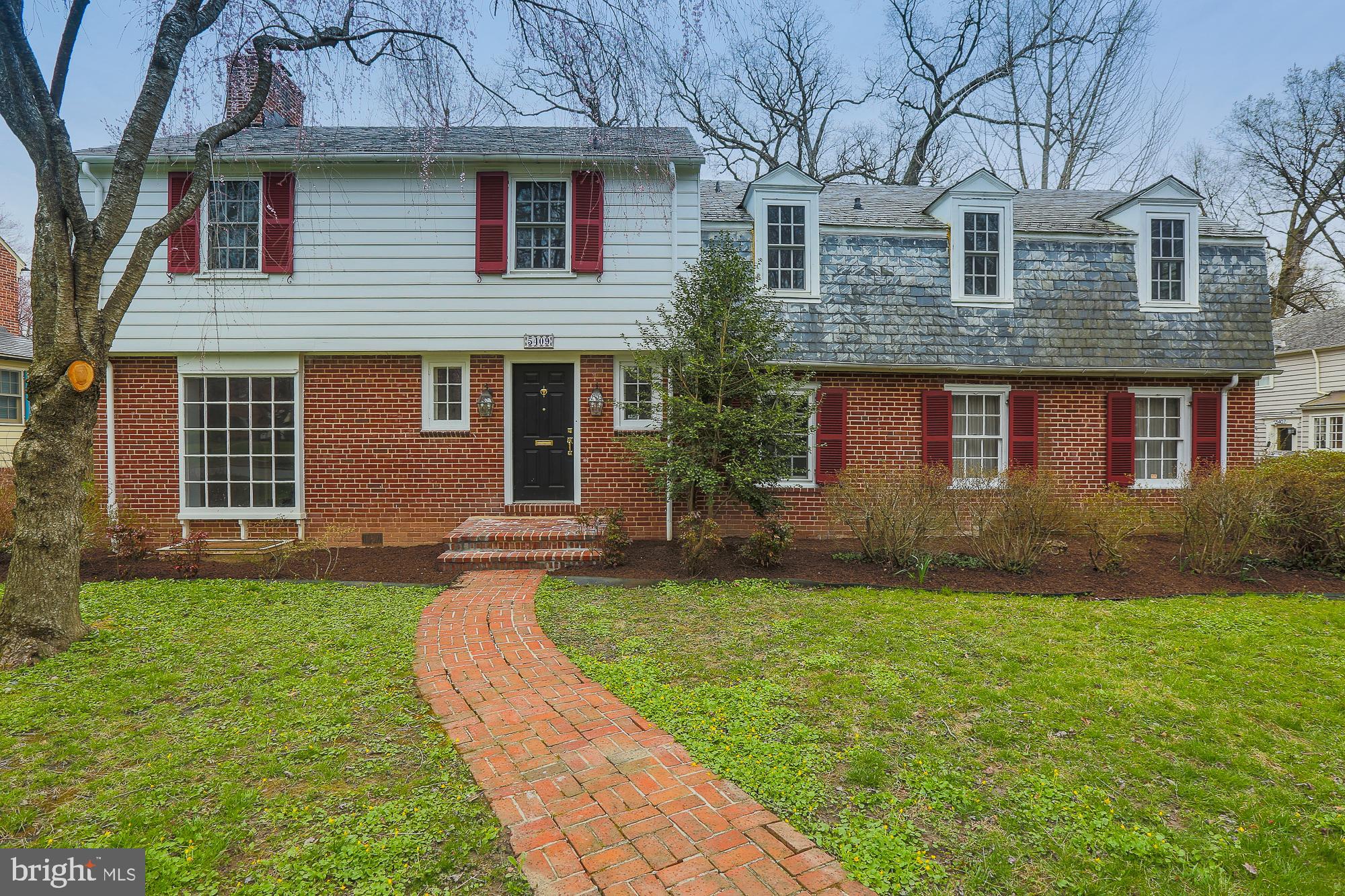 5409 Springlake Way Baltimore, MD 21212 - Photo 4 of 41 a front view of a house with a garden