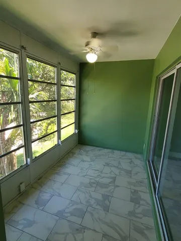 a bathroom with a granite countertop sink a mirror and shower