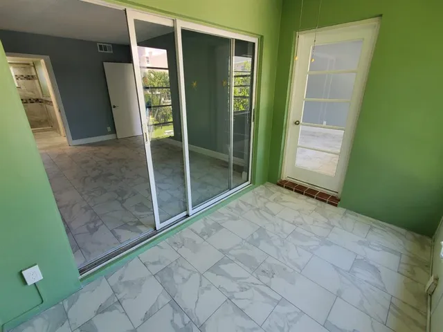 a view of a swimming pool with a patio