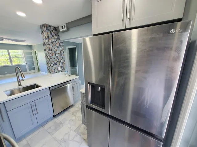 a view of a kitchen and a window