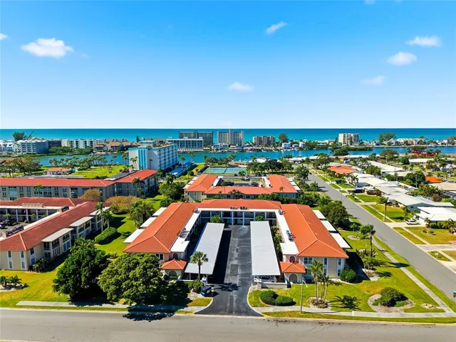 an aerial view of a house with outdoor space swimming pool
