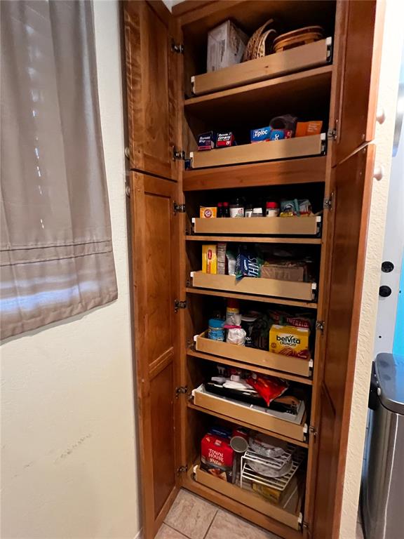 10350 Imperial Point Drive West, Unit 4 Largo, FL 33774 - Photo 12 of 68 a room with toys and a book shelf