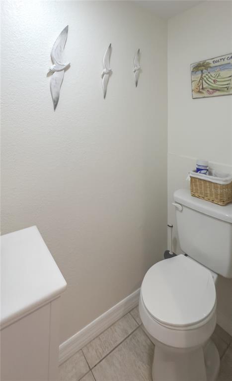 10350 Imperial Point Drive West, Unit 4 Largo, FL 33774 - Photo 17 of 68 a white toilet sitting next to a shower