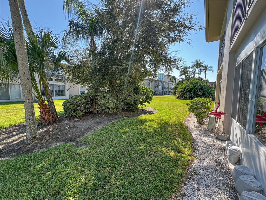 10350 Imperial Point Drive West, Unit 4 Largo, FL 33774 - Photo 22 of 68 a view of a backyard with garden