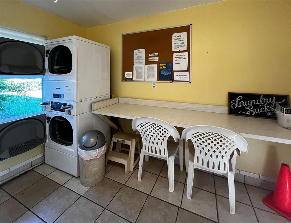 10350 Imperial Point Drive West, Unit 4 Largo, FL 33774 - Photo 26 of 68 a dining room with furniture and window