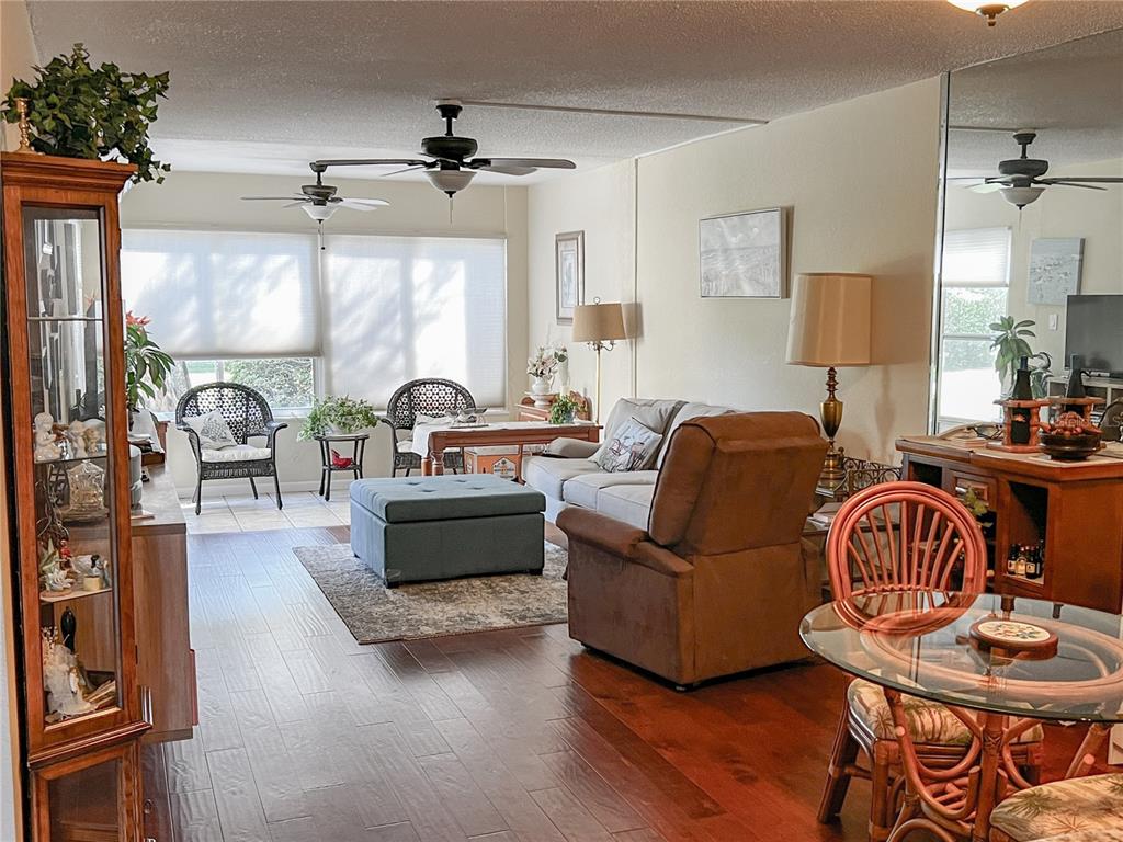 10350 Imperial Point Drive West, Unit 4 Largo, FL 33774 - Photo 3 of 68 a living room with furniture and a large window