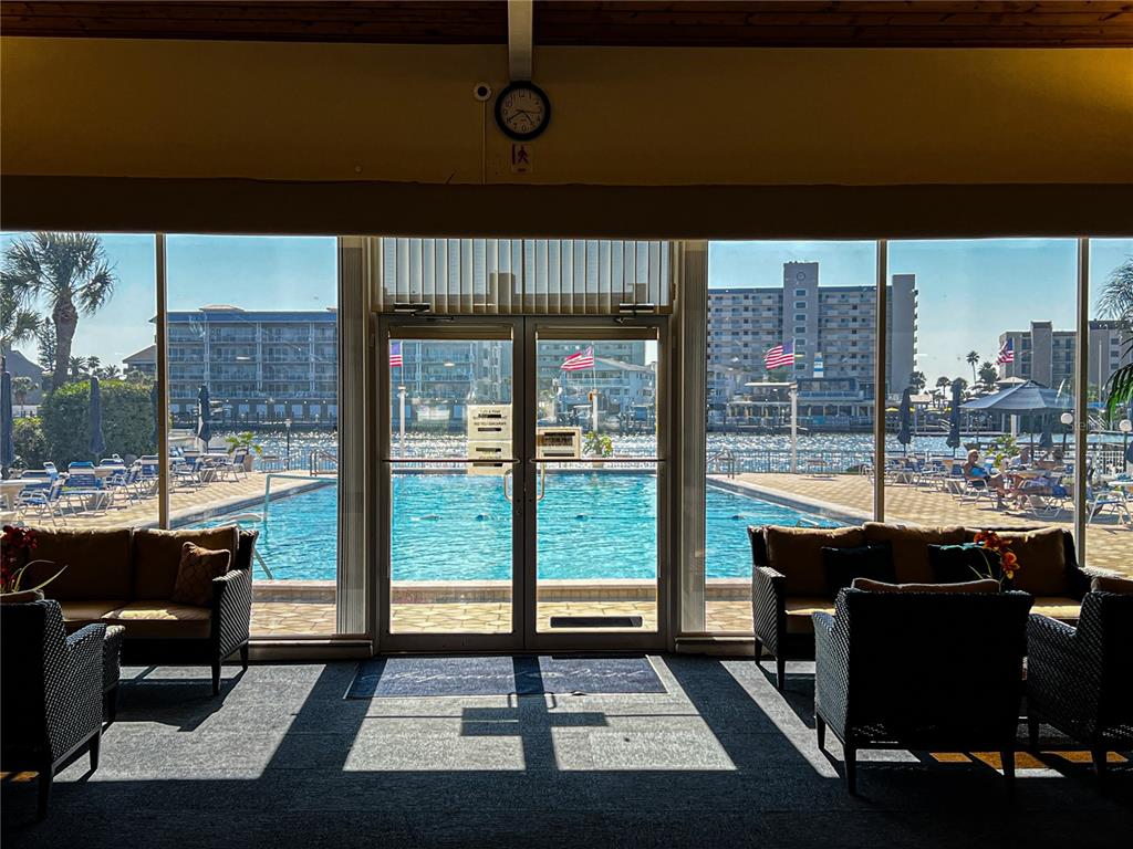 10350 Imperial Point Drive West, Unit 4 Largo, FL 33774 - Photo 31 of 68 a picture of a table and chairs in the patio