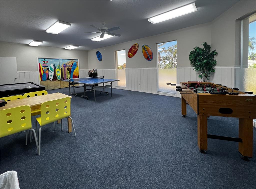 10350 Imperial Point Drive West, Unit 4 Largo, FL 33774 - Photo 36 of 68 a living room with furniture and a flat screen tv