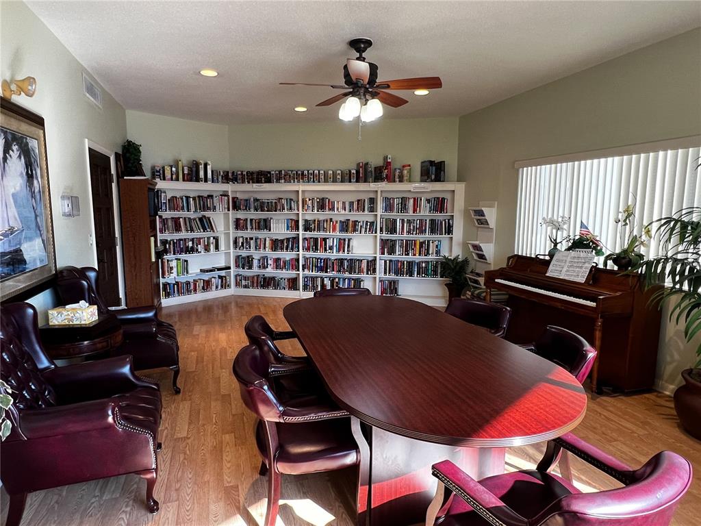 10350 Imperial Point Drive West, Unit 4 Largo, FL 33774 - Photo 38 of 68 a workspace with furniture window and book shelf