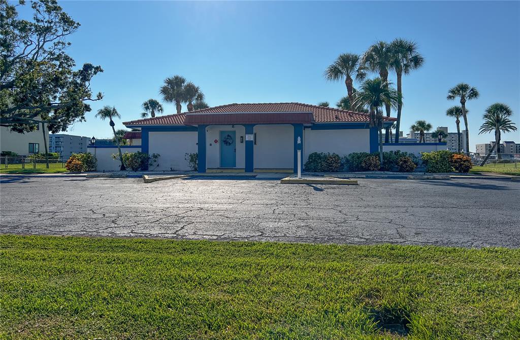 10350 Imperial Point Drive West, Unit 4 Largo, FL 33774 - Photo 43 of 68 a front view of a house with a yard