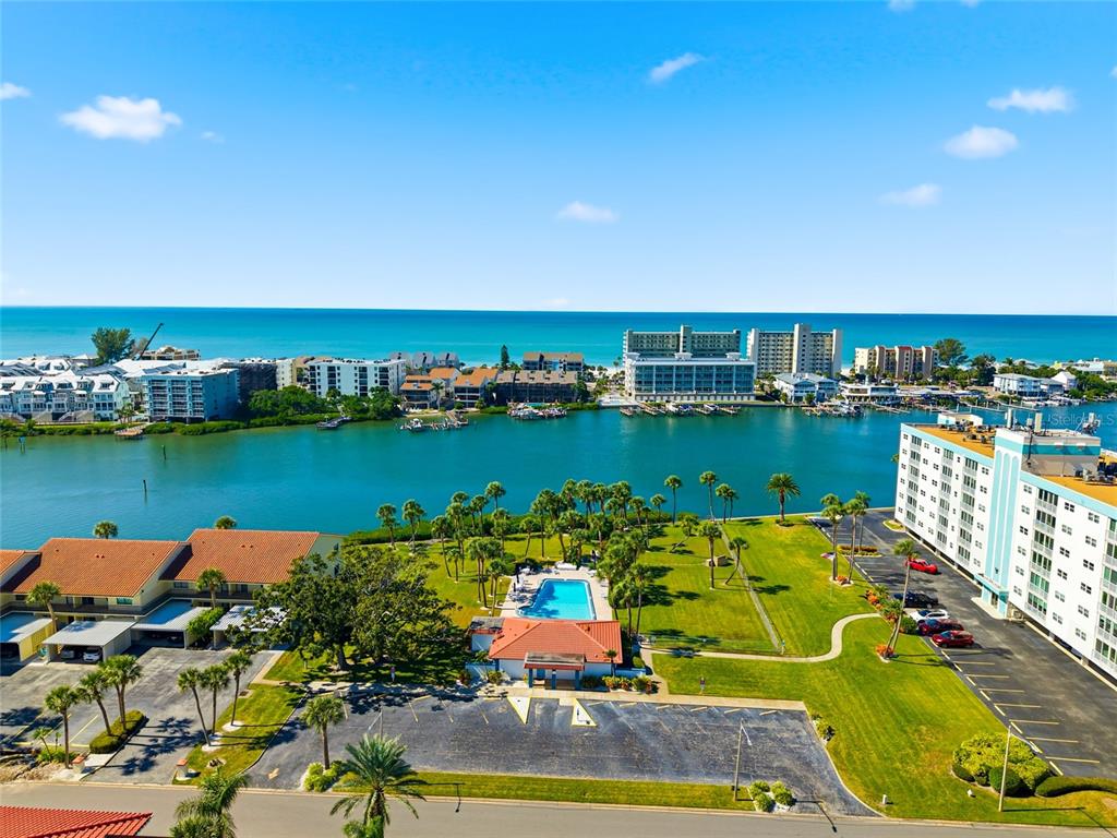 10350 Imperial Point Drive West, Unit 4 Largo, FL 33774 - Photo 48 of 68 an aerial view of a house with outdoor space lake view and large trees
