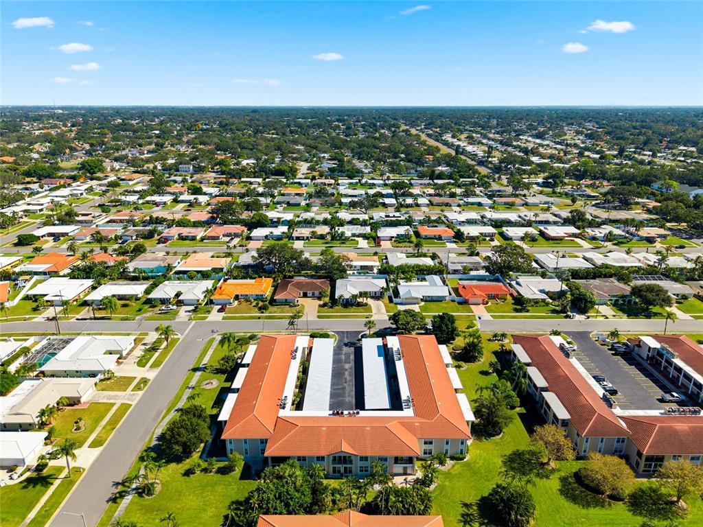 10350 Imperial Point Drive West, Unit 4 Largo, FL 33774 - Photo 54 of 68 an aerial view of residential houses with outdoor space