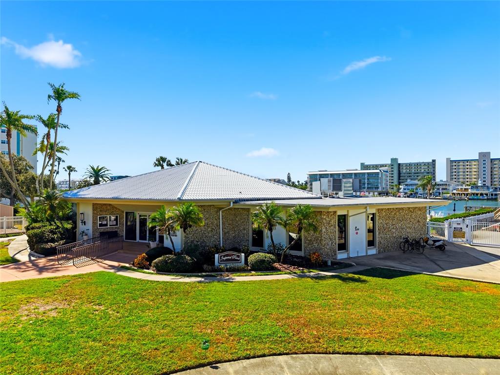 10350 Imperial Point Drive West, Unit 4 Largo, FL 33774 - Photo 57 of 68 a view of a swimming pool with a patio