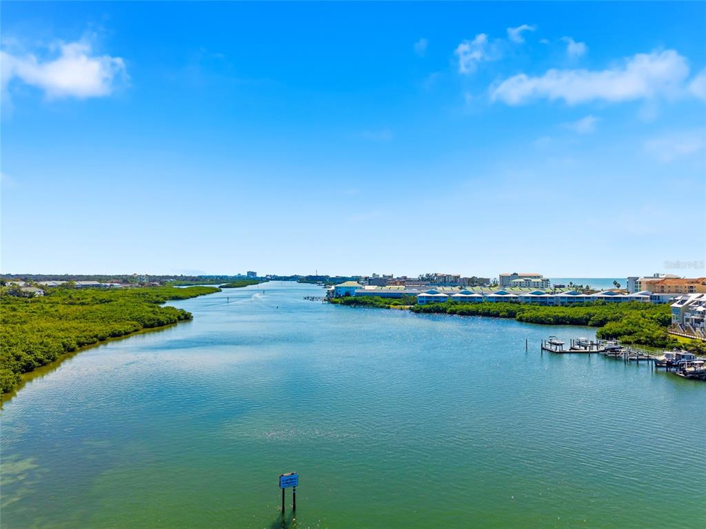 10350 Imperial Point Drive West, Unit 4 Largo, FL 33774 - Photo 67 of 68 a view of a lake with houses in the back