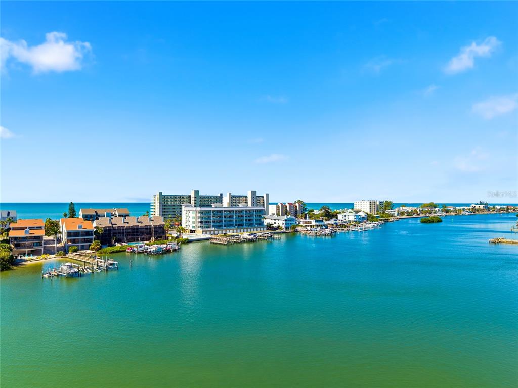 10350 Imperial Point Drive West, Unit 4 Largo, FL 33774 - Photo 68 of 68 a view of a ocean with boats and trees in the background