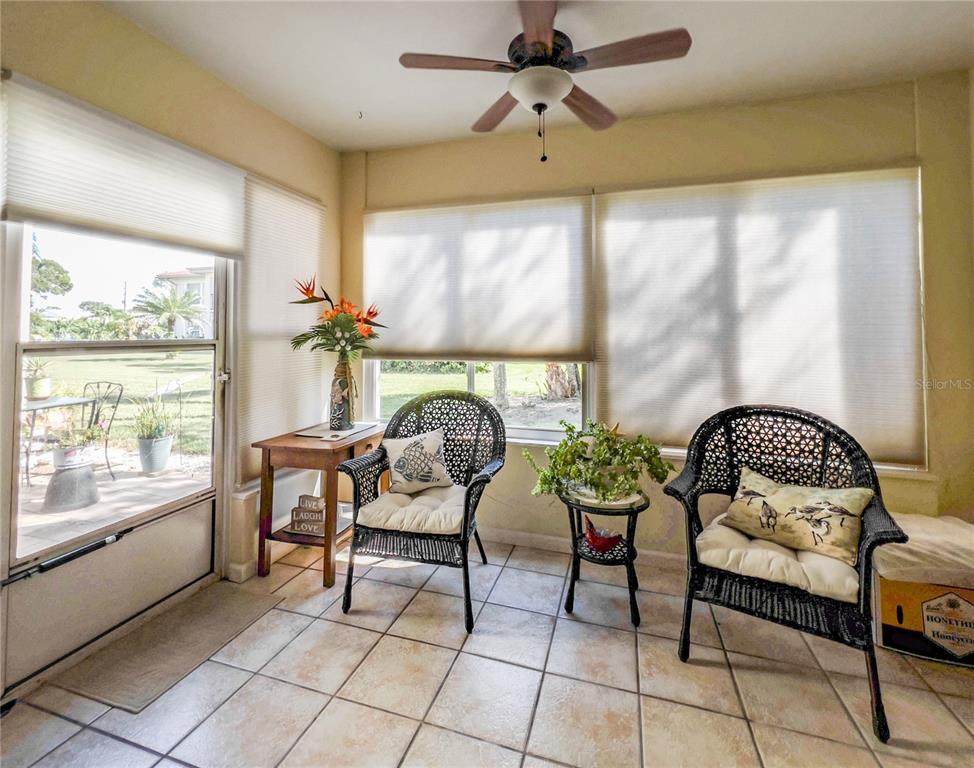 10350 Imperial Point Drive West, Unit 4 Largo, FL 33774 - Photo 7 of 68 a outdoor living space with furniture and a window