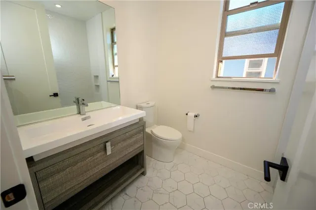 a kitchen with stainless steel appliances a microwave a stove and a refrigerator