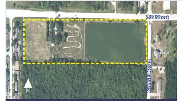 a view of a swimming pool with a yard