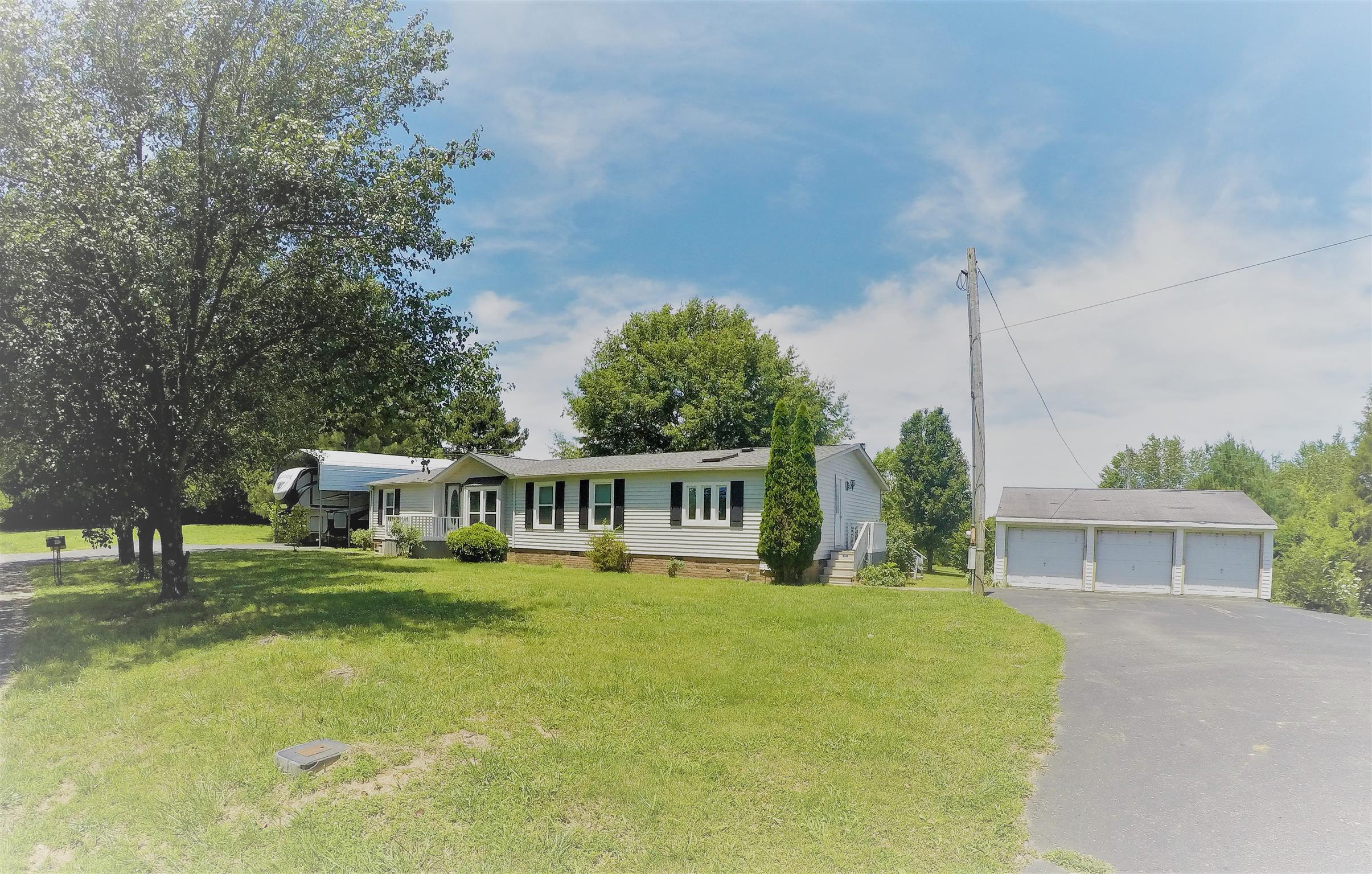 4012 Green Road Springfield, TN 37172 - Photo 1 of 17 a view of a house with a big yard and potted plants