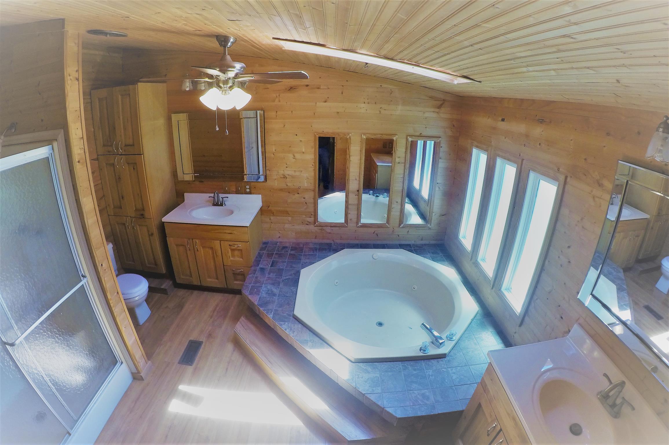 4012 Green Road Springfield, TN 37172 - Photo 12 of 17 a bathroom with a tub sink and mirror