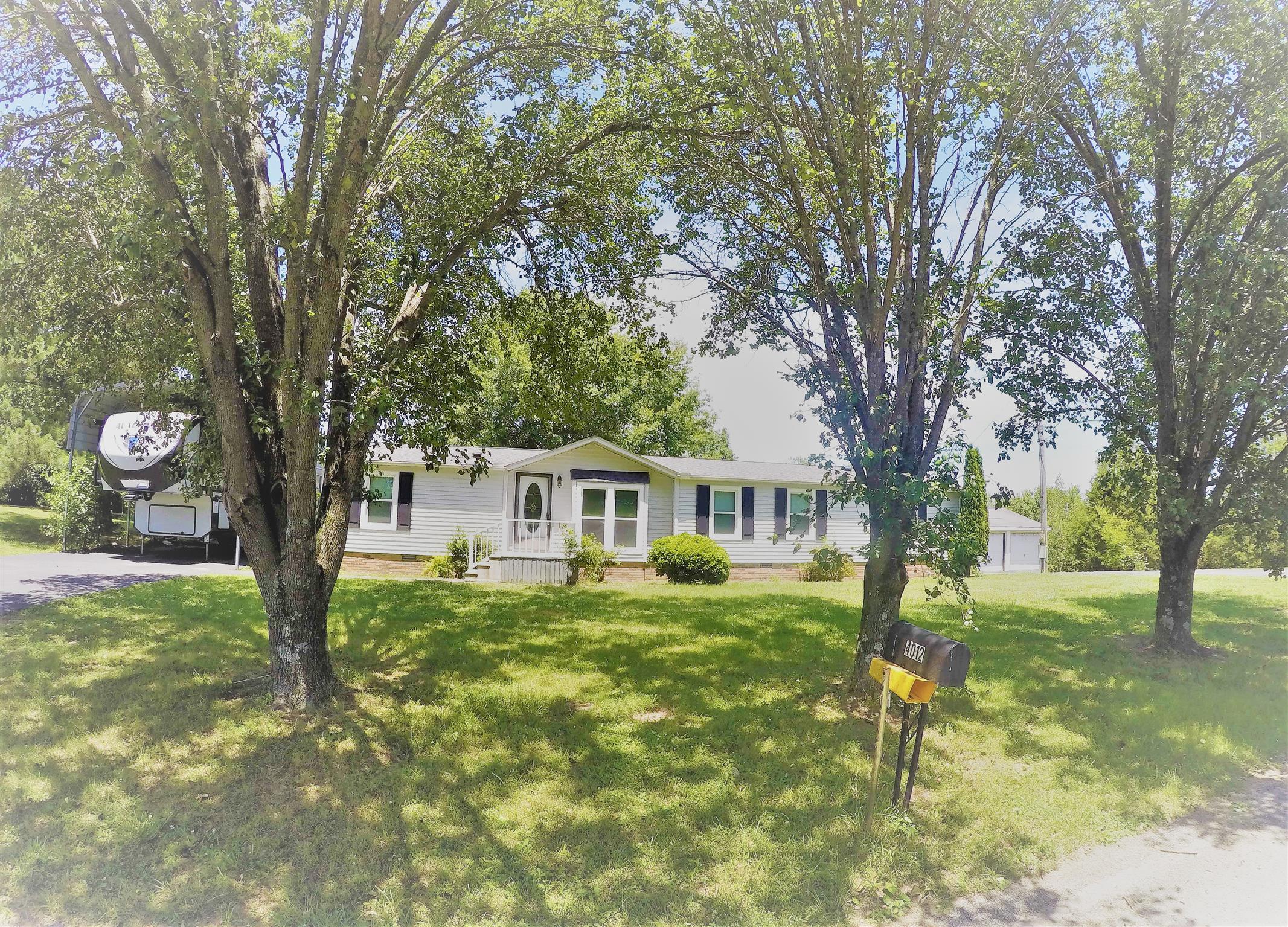 4012 Green Road Springfield, TN 37172 - Photo 2 of 17 a front view of a house with garden