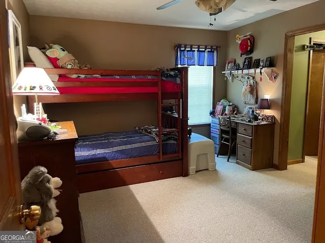 a kitchen with a refrigerator and a sink