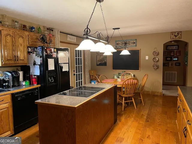 a kitchen with a dining table and chairs