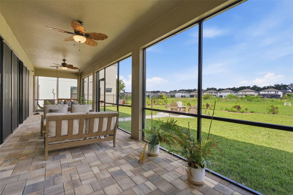 12970 Steed Trce Loop Lithia, FL 33547 - Photo 47 of 57 a view of living room with a floor to ceiling window and an outdoor view