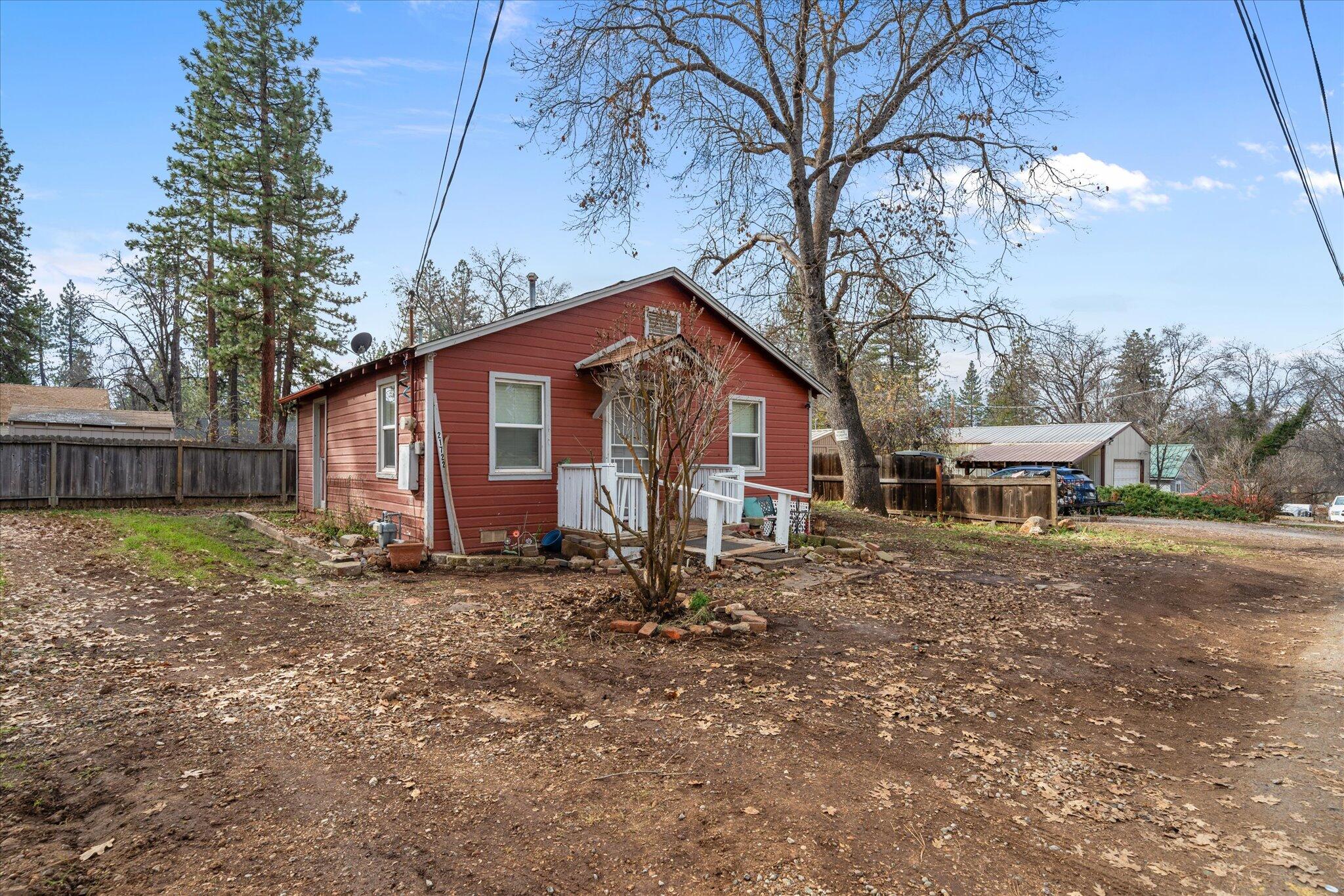21722 3rd Street Burney, CA 96013 - Photo 21 of 33 a backyard of a house with table and chairs