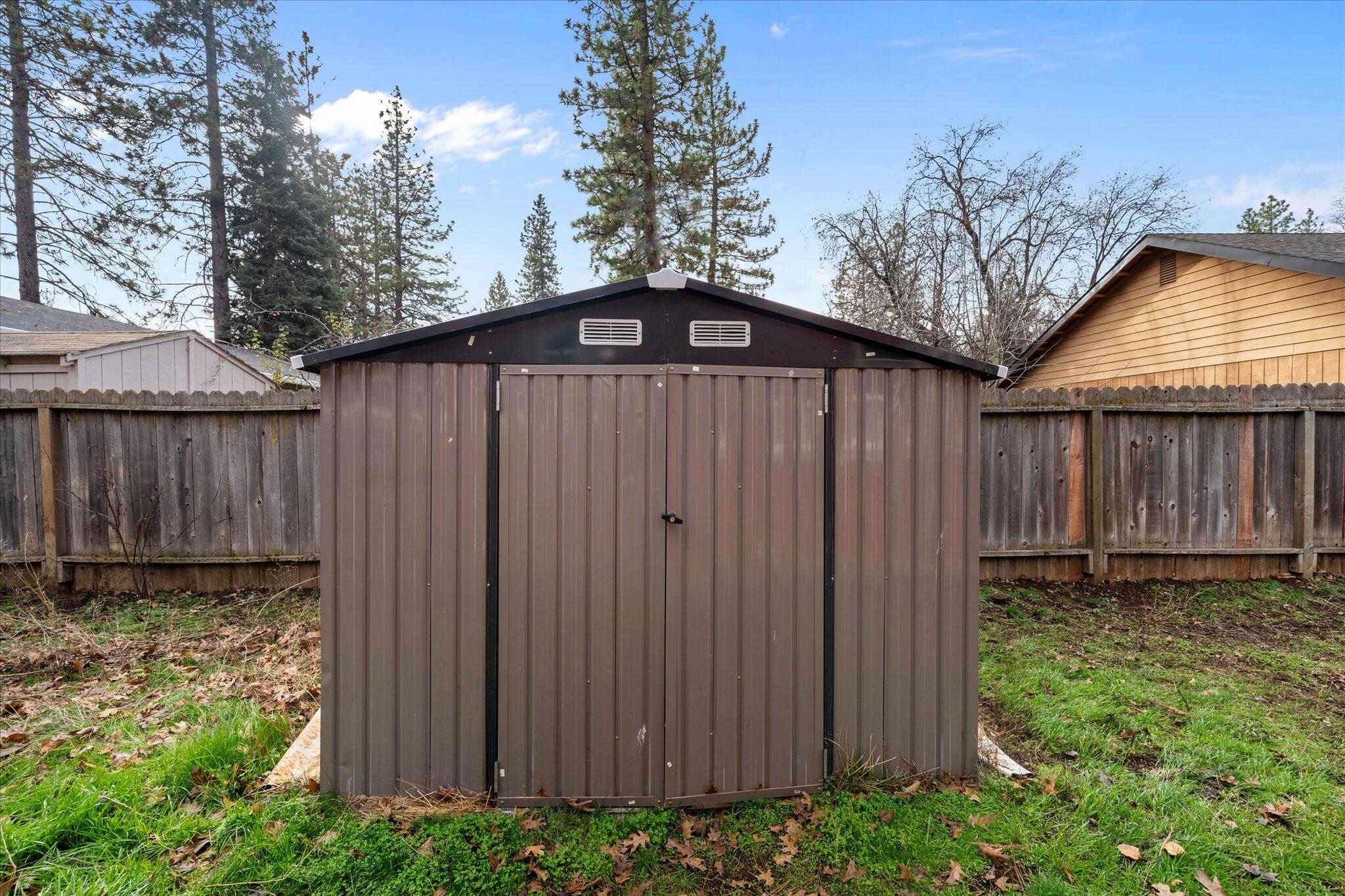 21722 3rd Street Burney, CA 96013 - Photo 27 of 33 a view of a backyard with wooden fence
